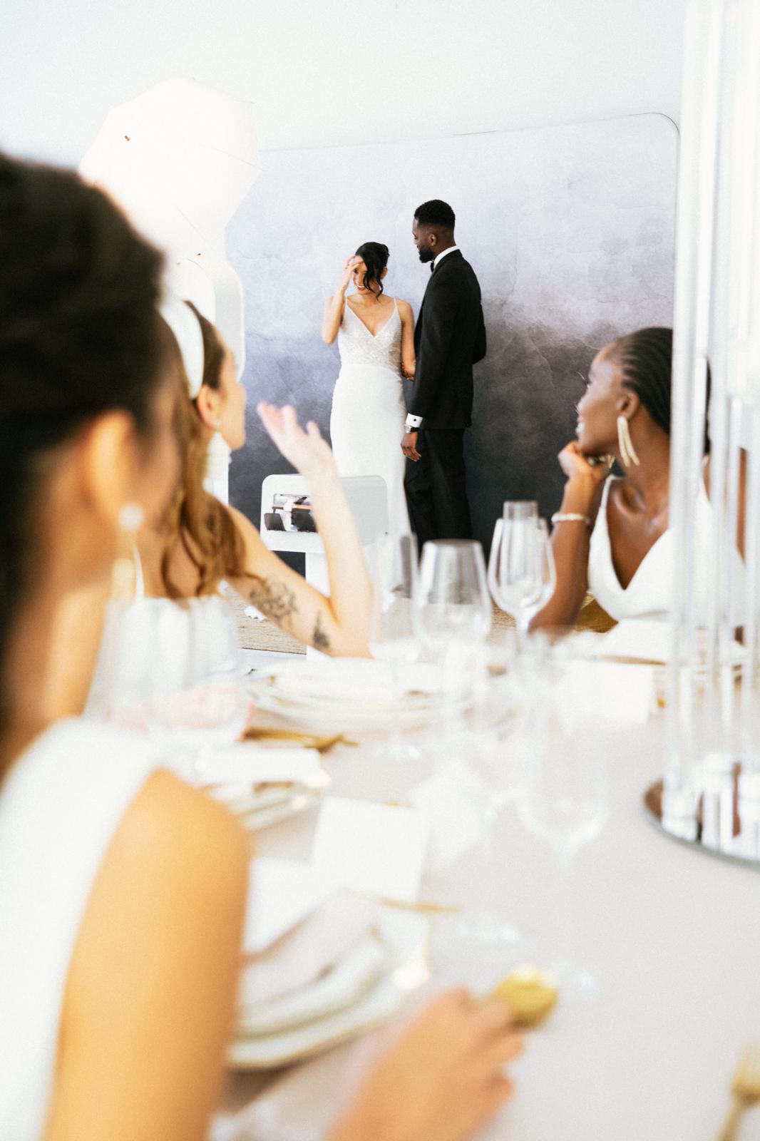 The Flash Bar photobooth reflected in glassware at a wedding reception
